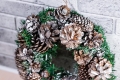 christmas-wreath-made-fir-branches-natural-cones-against-background-gray-brick-wall-new-year-winter-holidays-christmas-decor.jpg